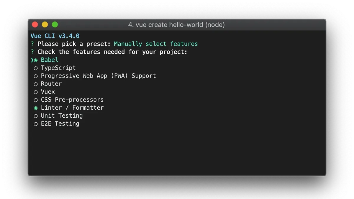 Developer installing Vue CLI on Mac laptop showing terminal commands