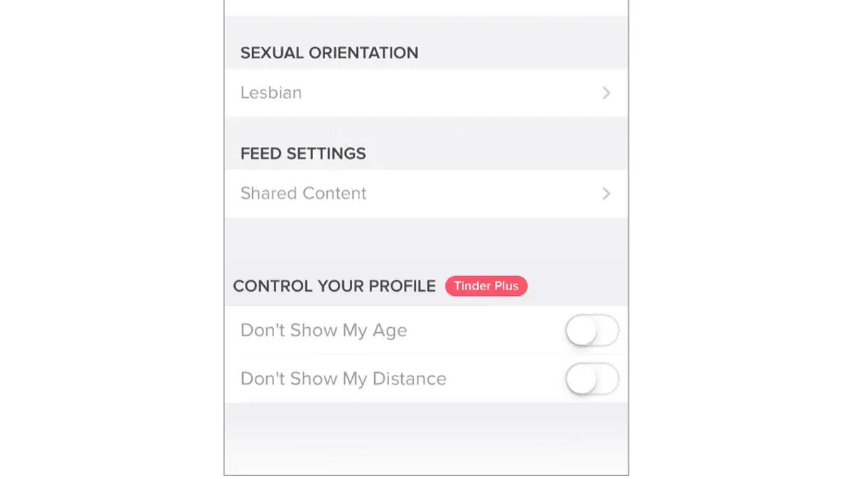 Person adjusting Tinder privacy settings on smartphone for safer dating