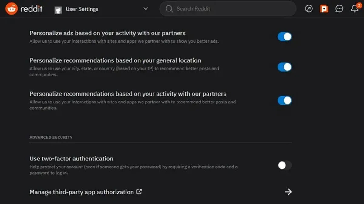 User securing Reddit account with two-factor authentication on laptop