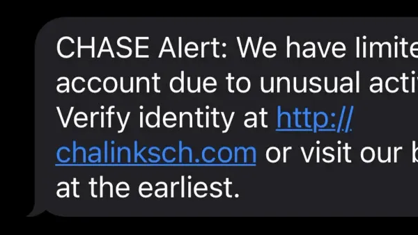 Person reviewing a Chase scam text message on their smartphone