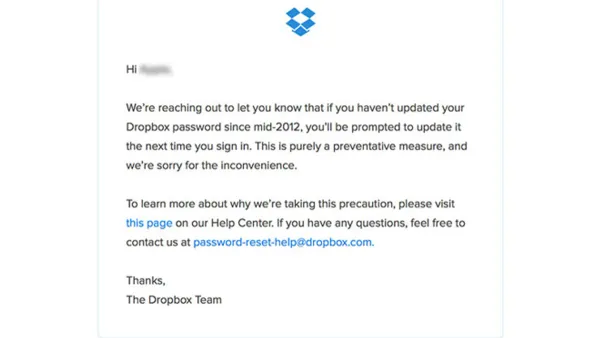 User securing Dropbox account hacked risks on laptop with security measures